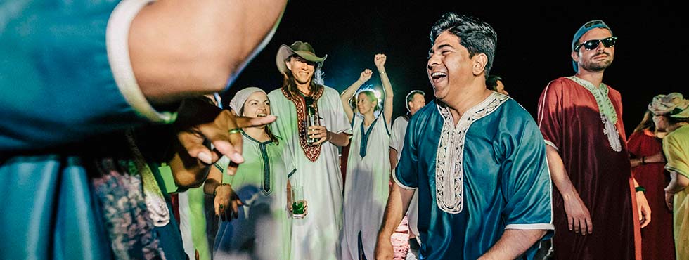 incentive travel trip attendees dancing at evening event